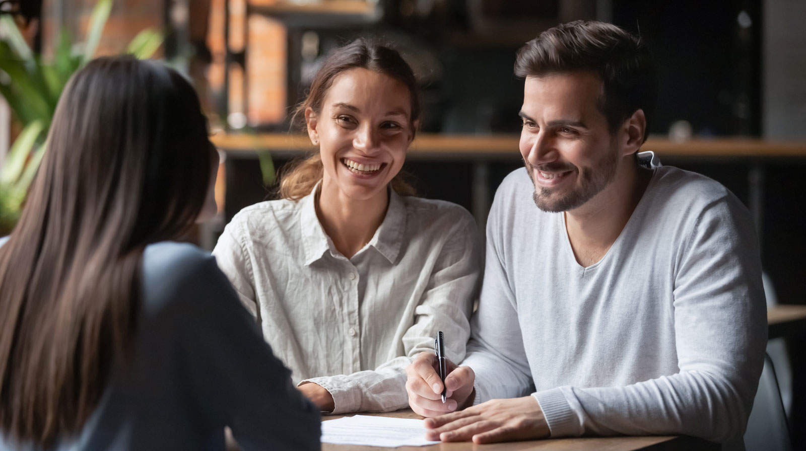 Azure Dental Cancellation Policy 1 Dentist smiling with couple during dental consultation – Family Dental Practice in Marshfield, MA
